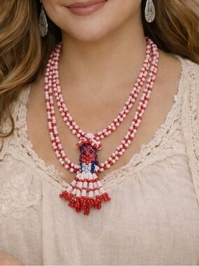 Native American, glass beaded doll pendant.